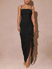 Black ruched midi dress with spaghetti straps and a ruffled high slit.