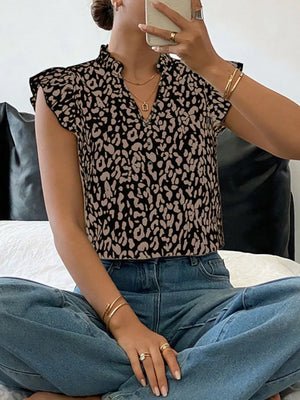 Leopard print ruffle sleeve top with mock neck and v-neck detail.