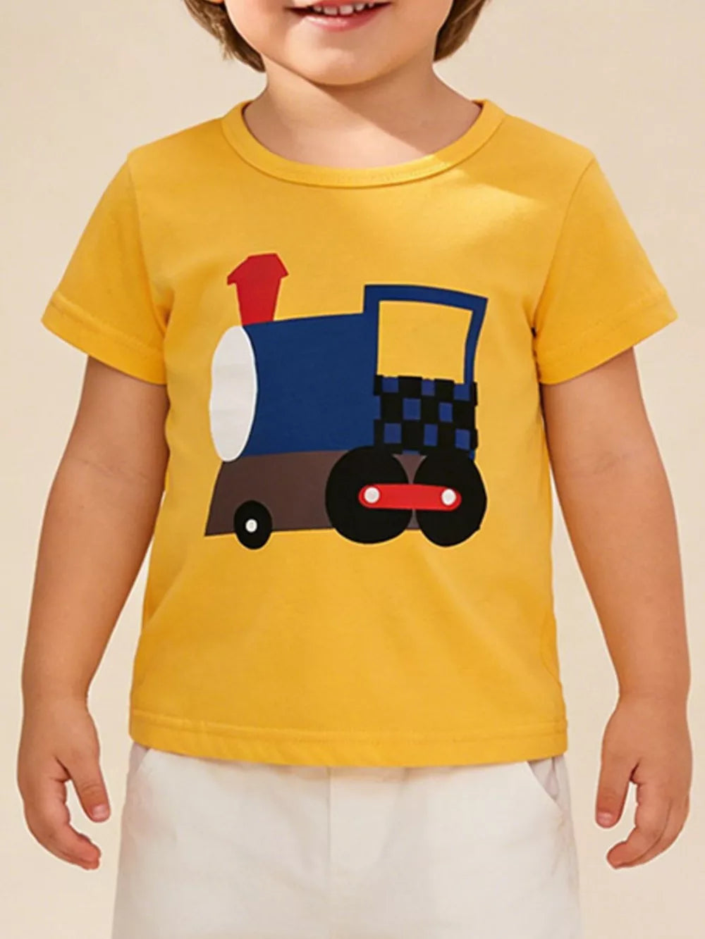 Yellow cotton t-shirt with a playful blue and brown train graphic for toddlers.