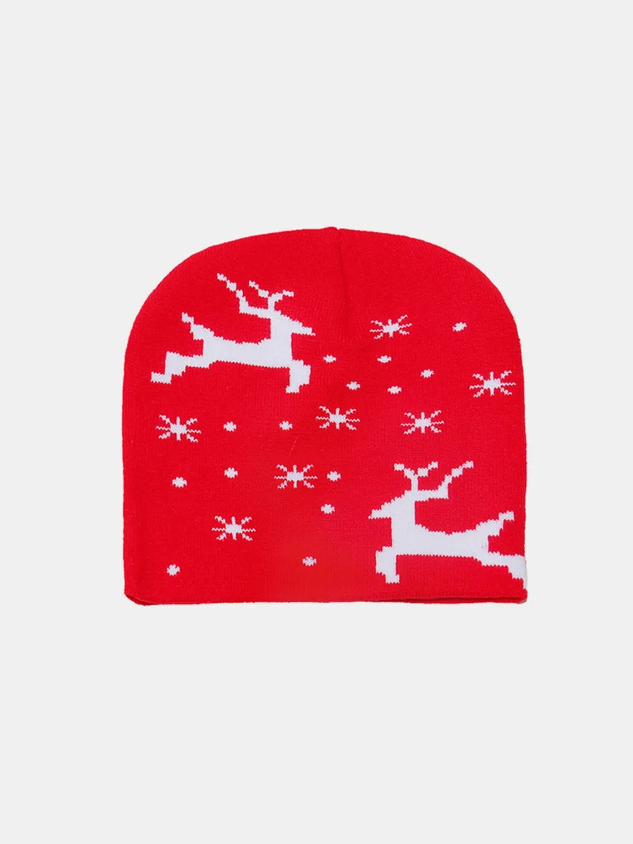 Red acrylic knit beanie with white reindeer and snowflake pattern.