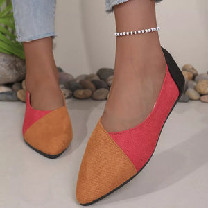 Chic pointed-toe slip-on flats in color block tan and coral with a black heel.