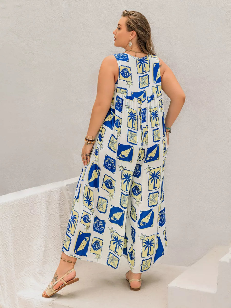 Plus-size relaxed jumpsuit with nautical print, featuring shells and palm trees, wide legs, and a gathered waist.