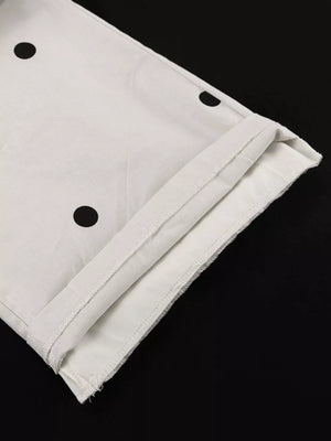 White polka dot pants with a rolled hem