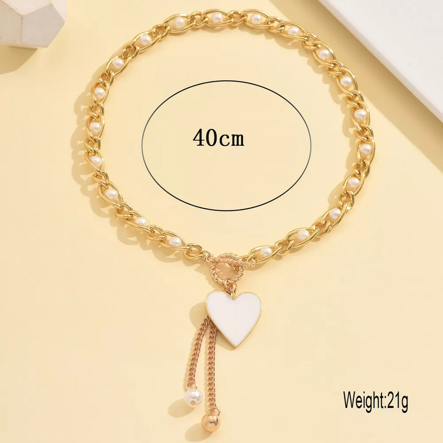 necklace in ivory with heart pendant and choker length
