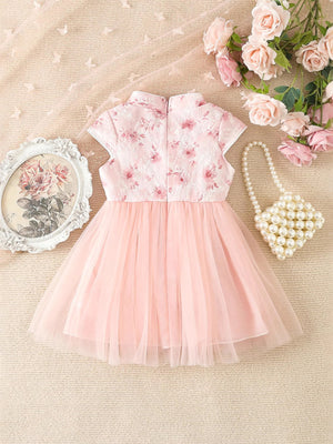 Pink floral cap sleeve baby dress with a tulle skirt and mandarin collar.