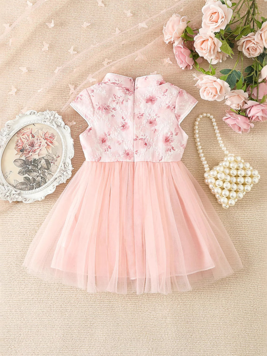 Pink floral cap sleeve baby dress with a tulle skirt and mandarin collar.