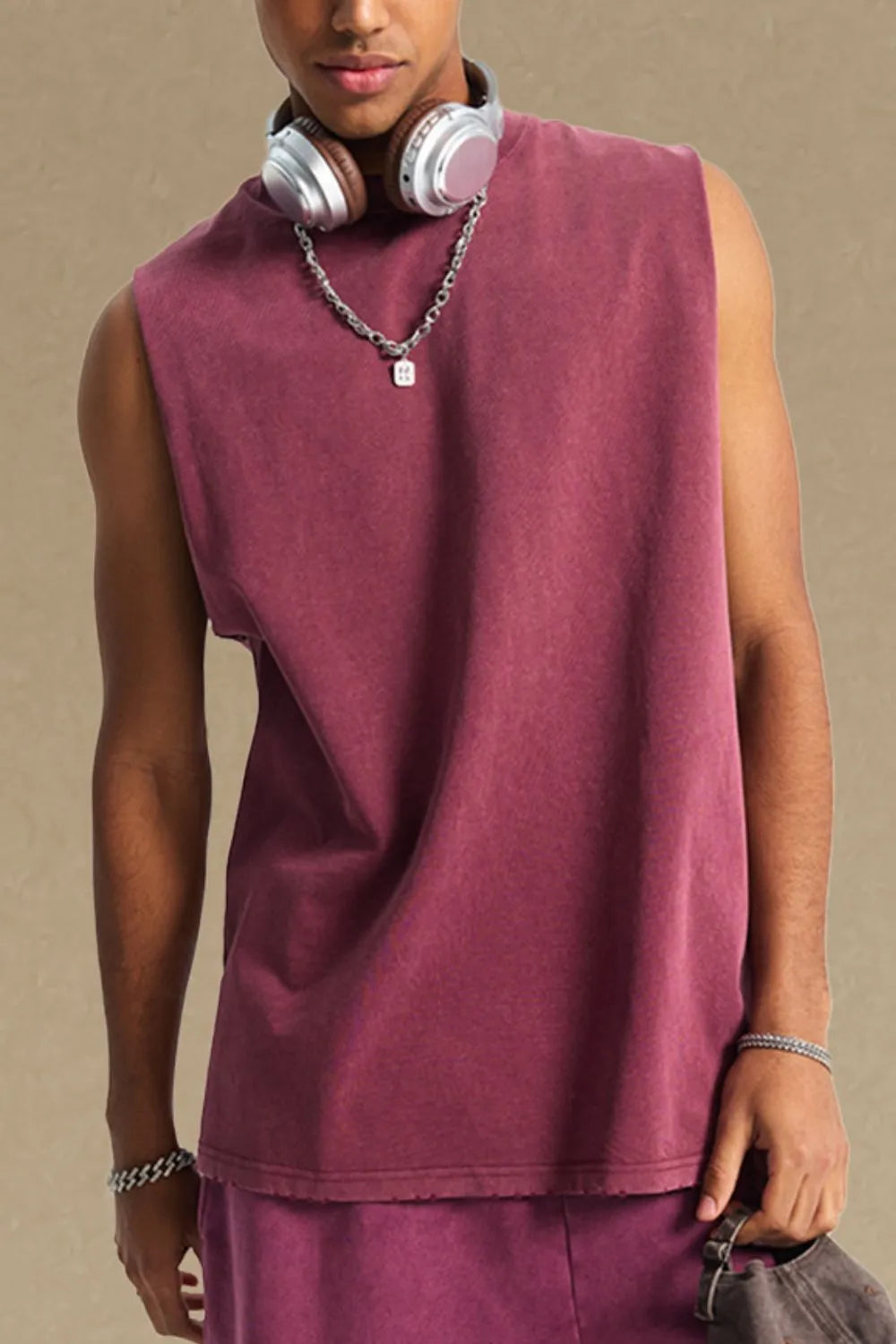 Washed cotton muscle tank in burgundy with a relaxed fit and raw hem.