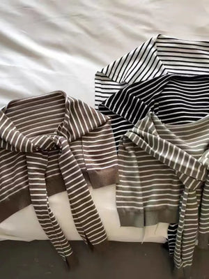 Tie-front breton stripe sweater in black and white, camel, and moss green acrylic.