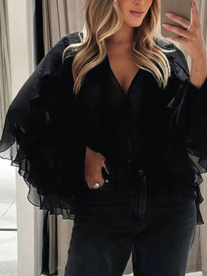 Black sheer long-sleeve blouse with ruffled details and a V-neck.