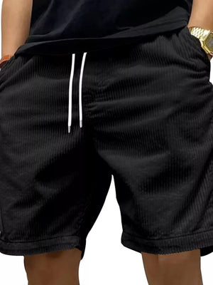 Black corduroy chino shorts with white drawstring and pockets.
