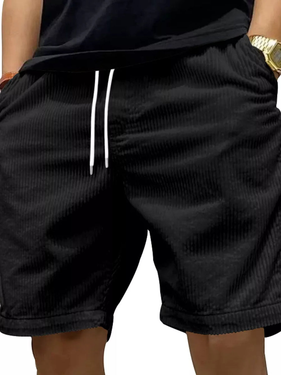 Black corduroy chino shorts with white drawstring and pockets.