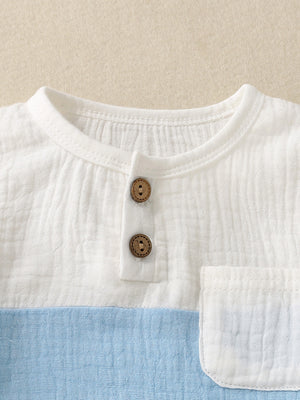Children's color-block cotton top with two wooden buttons and a chest pocket.