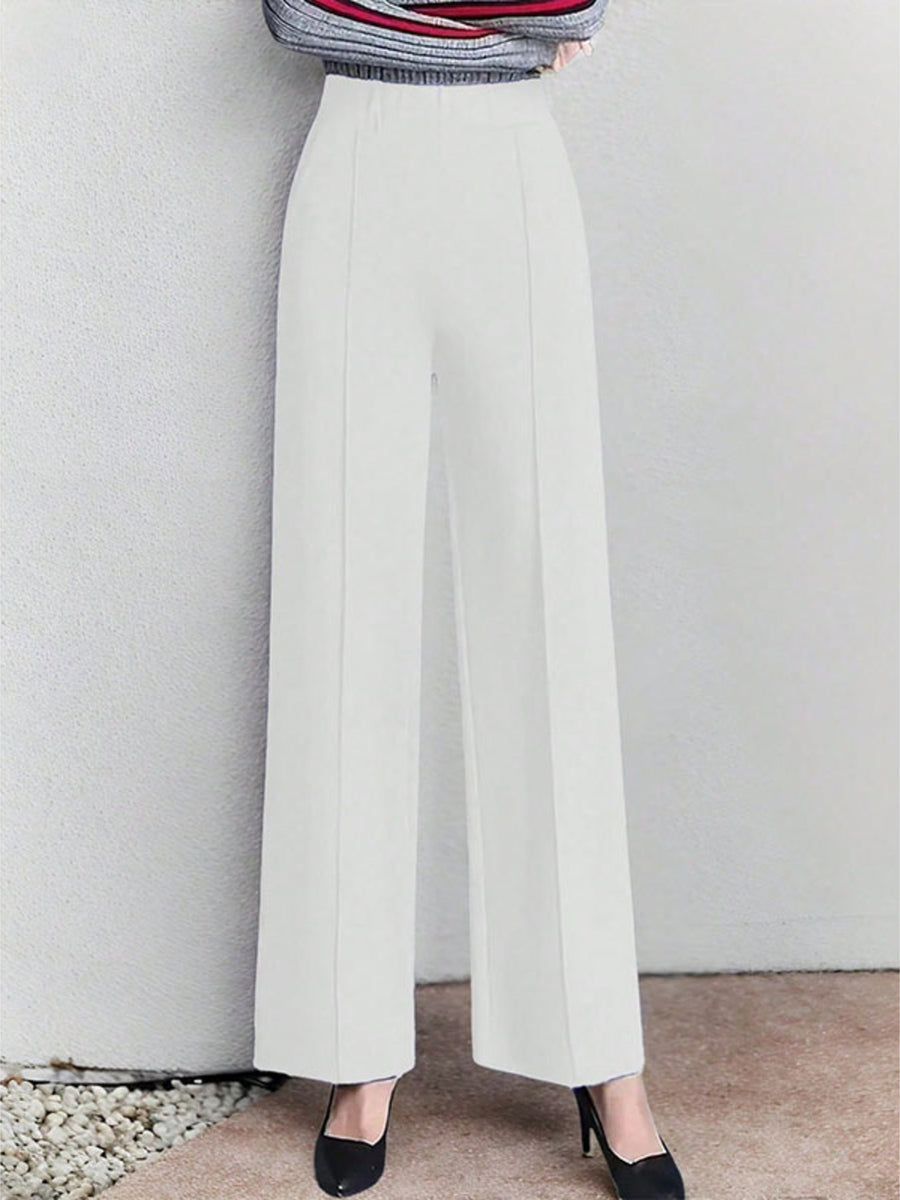 White high-waisted wide leg cotton trousers with pockets, elegant and comfortable.