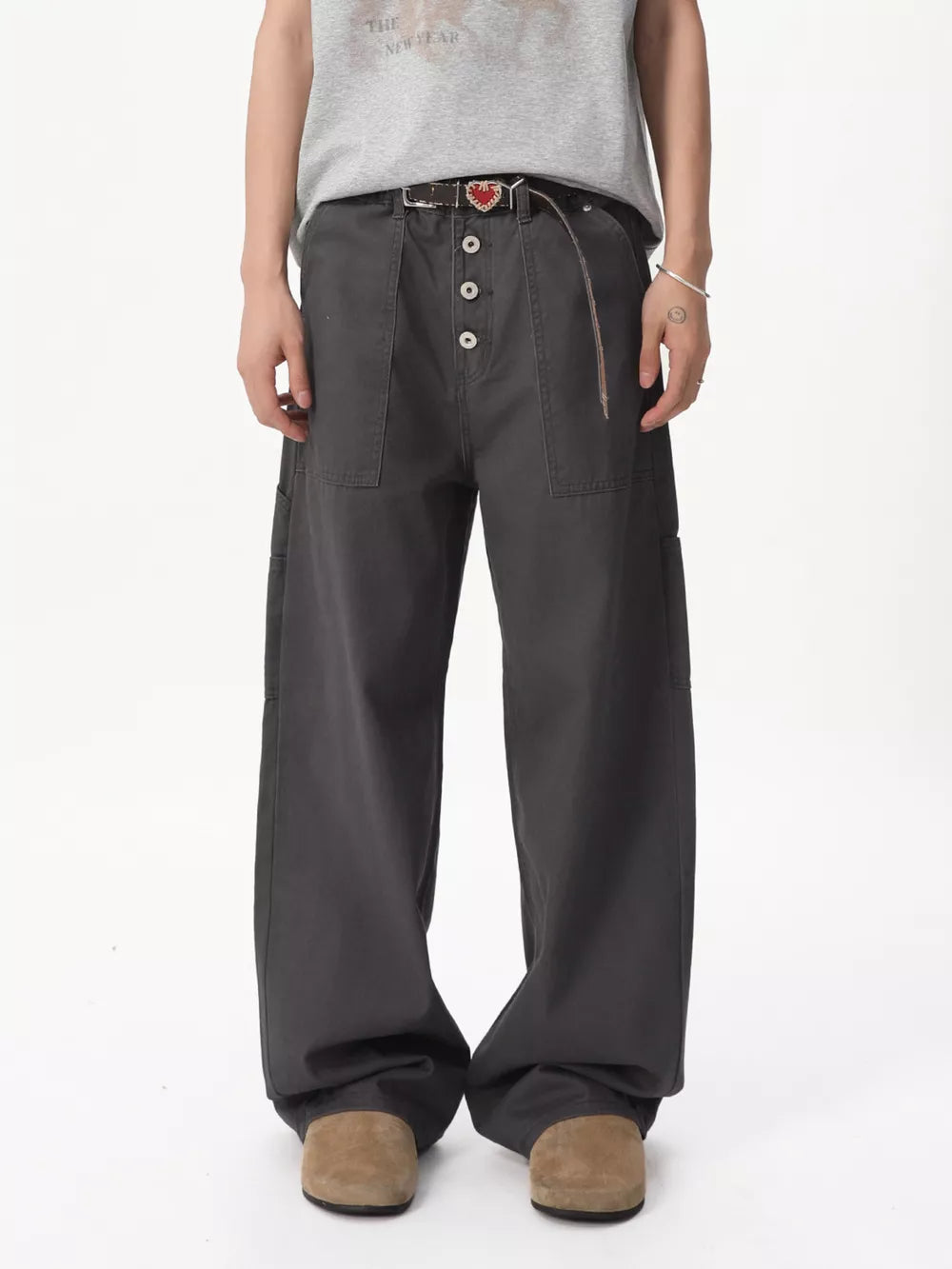 Relaxed wide-leg cargo pants in gray cotton with button fly and cargo pockets.