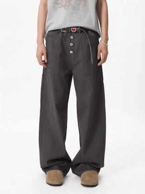 Relaxed wide-leg cargo pants in gray cotton with button fly and cargo pockets.
