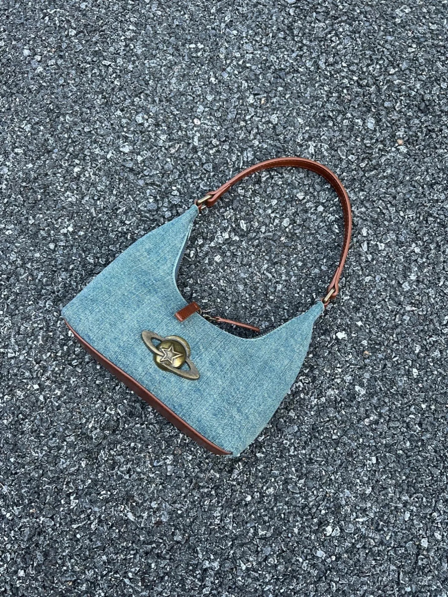 Denim shoulder bag with planet charm and brown trim