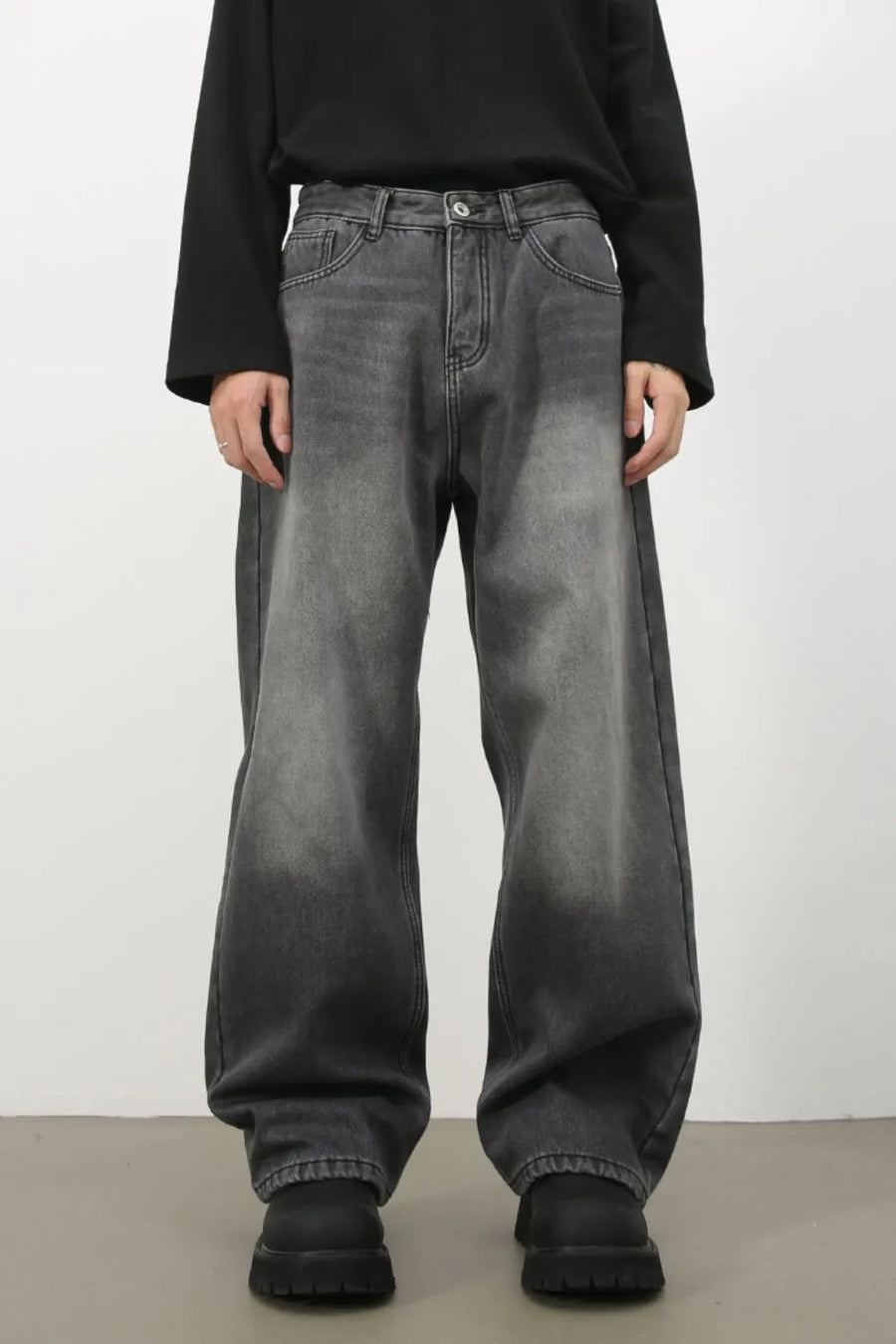 Faded dark gray cotton denim jeans with a wide-leg silhouette.