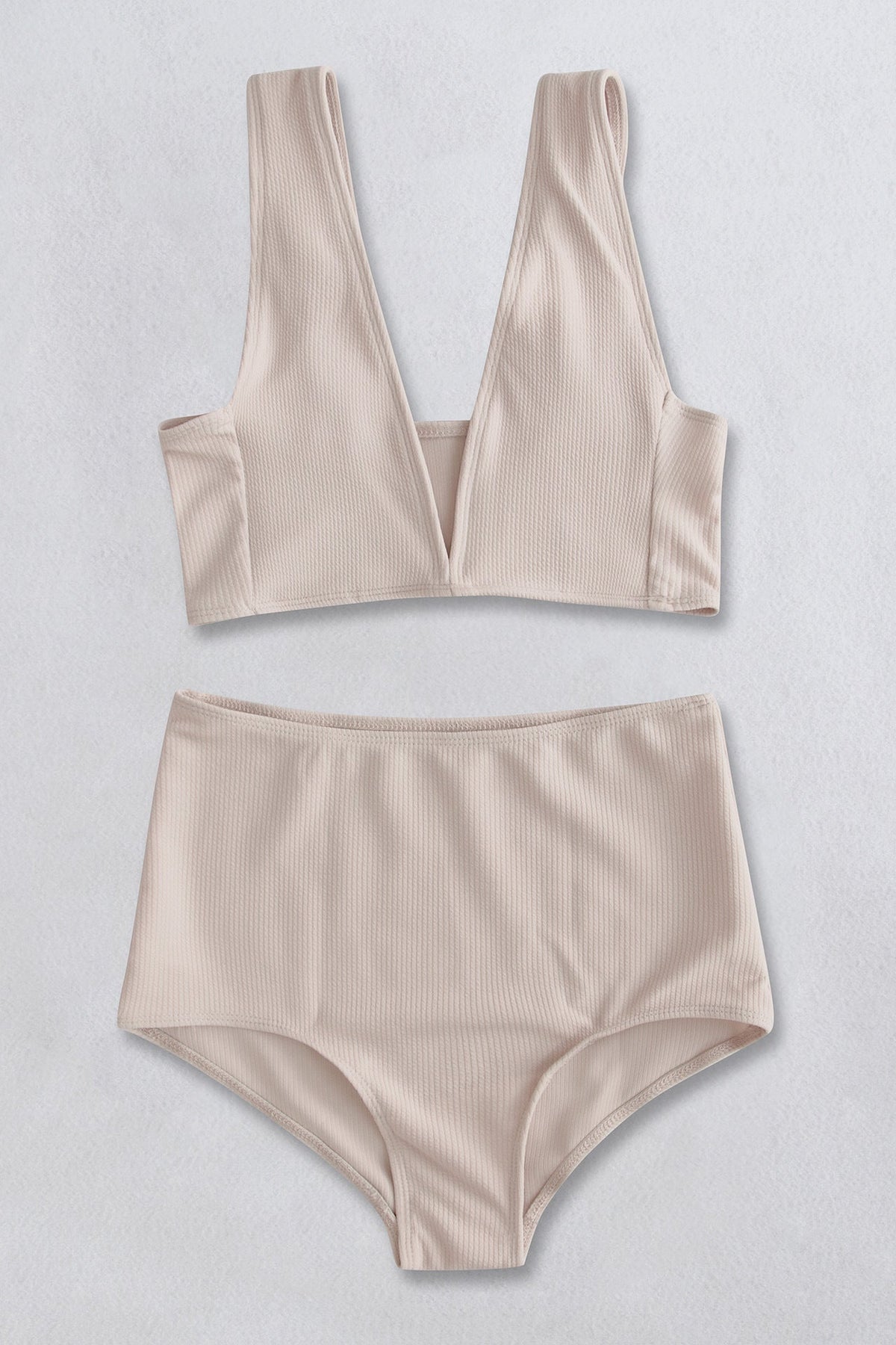 Cream ribbed high-waist plunge bikini set with a deep V-neckline and high-cut bottoms.