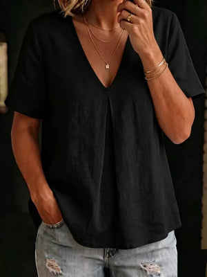 Black linen blend v-neck short sleeve top with subtle pleating and a relaxed fit