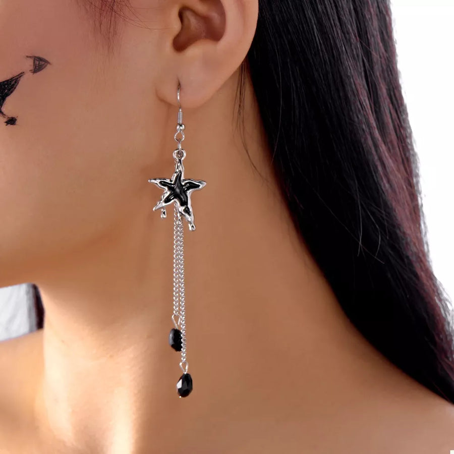 black earrings featuring star motif and celestial