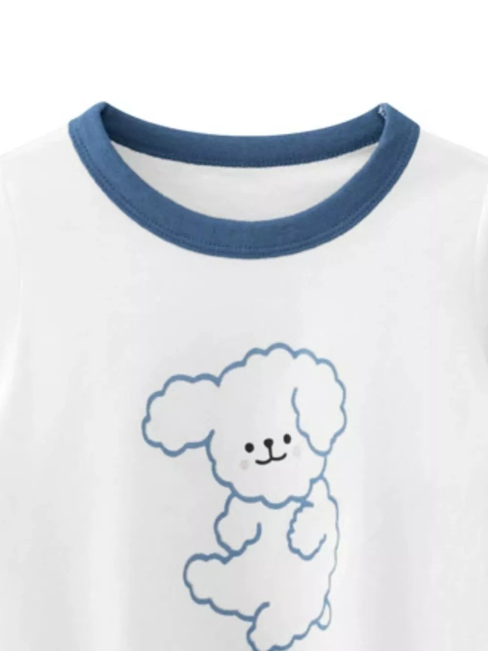 White t-shirt with blue trim and a cute cartoon dog print.