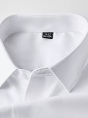 White men's long sleeve shirt with button collar detail and size tag.
