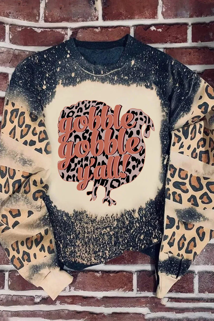 Black graphic sweatshirt with leopard print turkey and "Gobble Gobble Y'all" text.