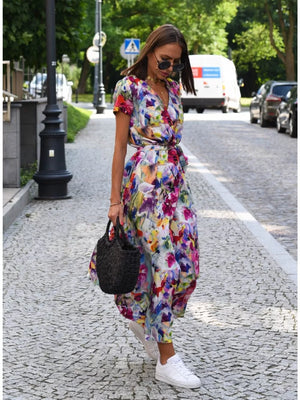 Wrap dress with colorful floral print, short sleeves, and tie waist.