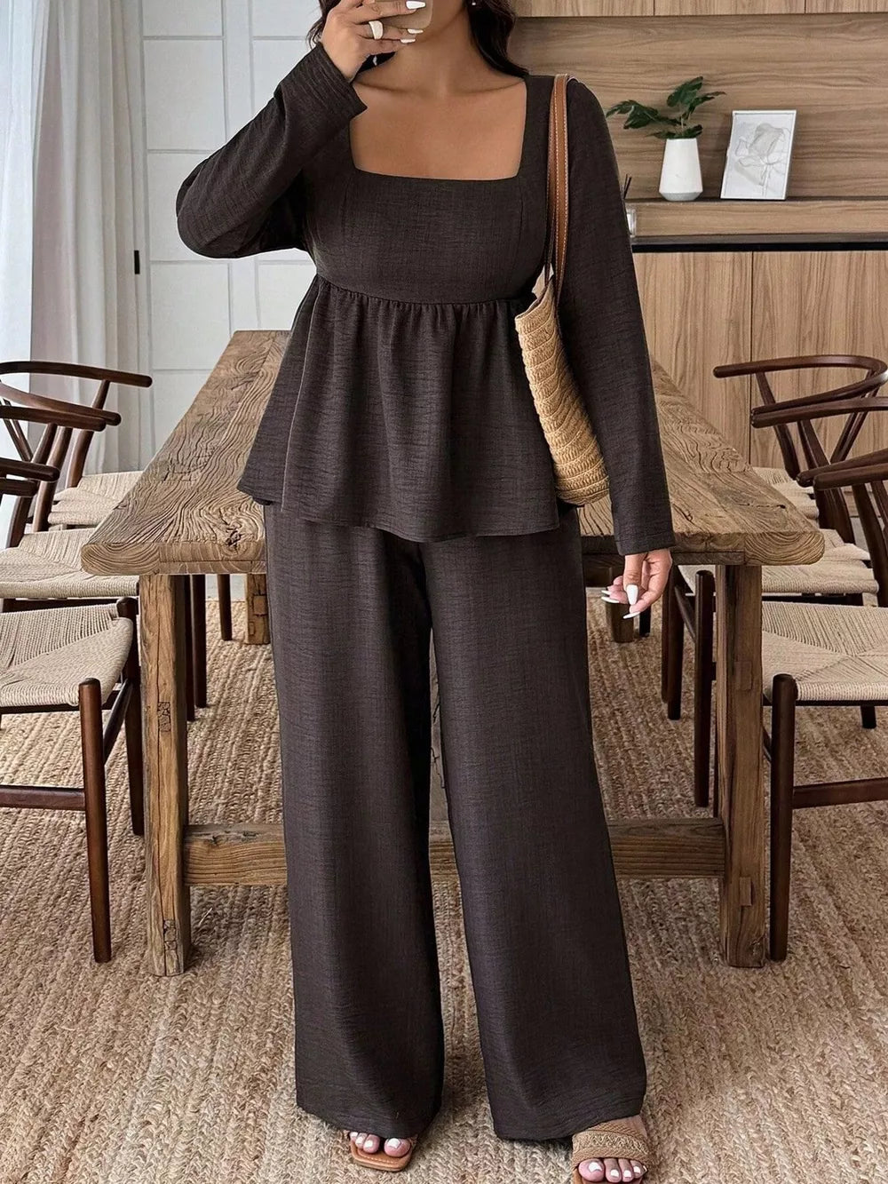 Dark brown ruched square neck peplum top and wide-leg pants set.