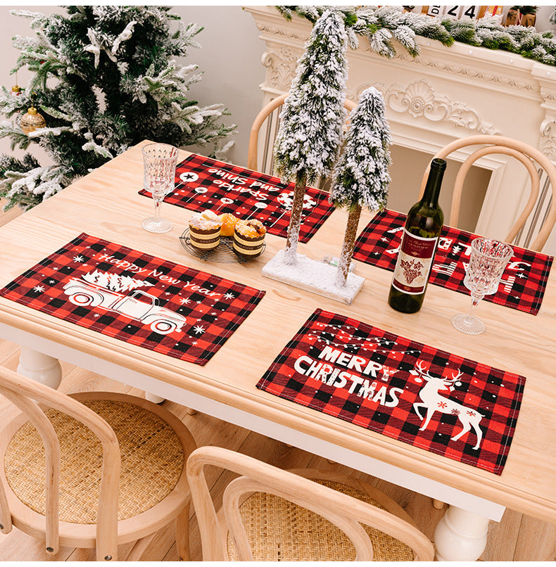Festive plaid placemats with Christmas truck and reindeer designs.