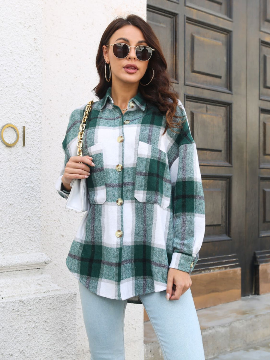 Oversized green plaid shacket with gold buttons and chest pockets.