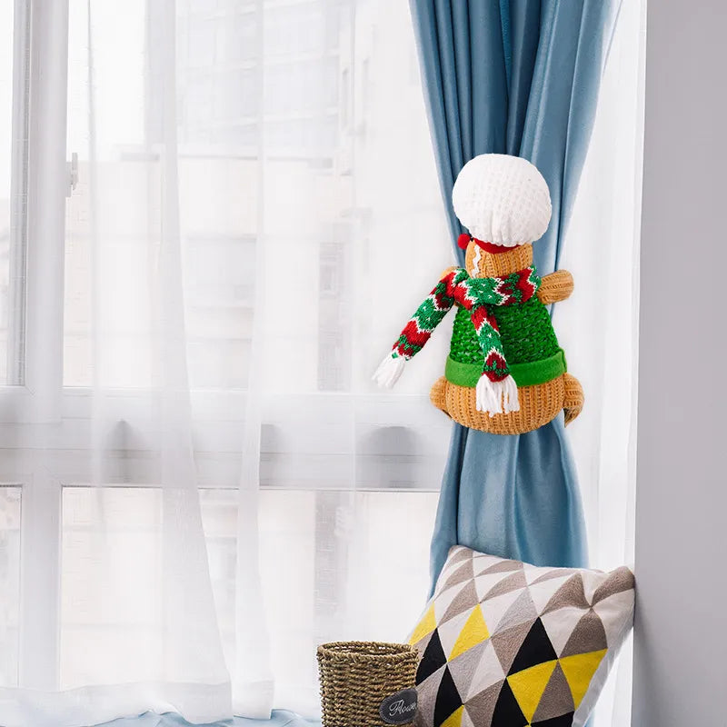 Gingerbread man curtain tieback in green with red and white striped scarf and white hat.