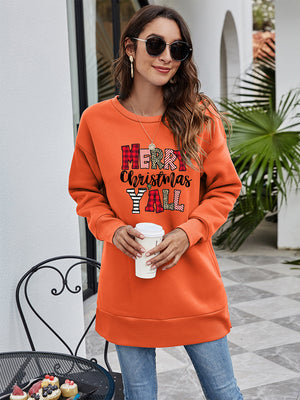 Orange oversized sweatshirt with Merry Christmas Y'all graphic and crew neck.