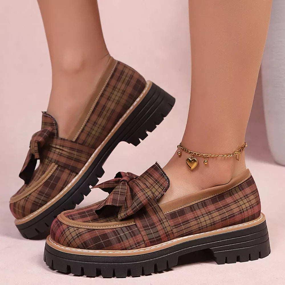 Plaid chunky loafers with bow accent in tan, featuring a lug sole and round toe.