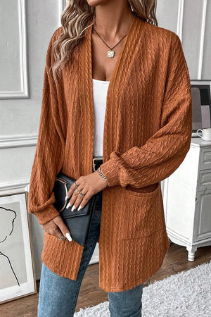 Terracotta open front cardigan with cable knit texture and pockets.