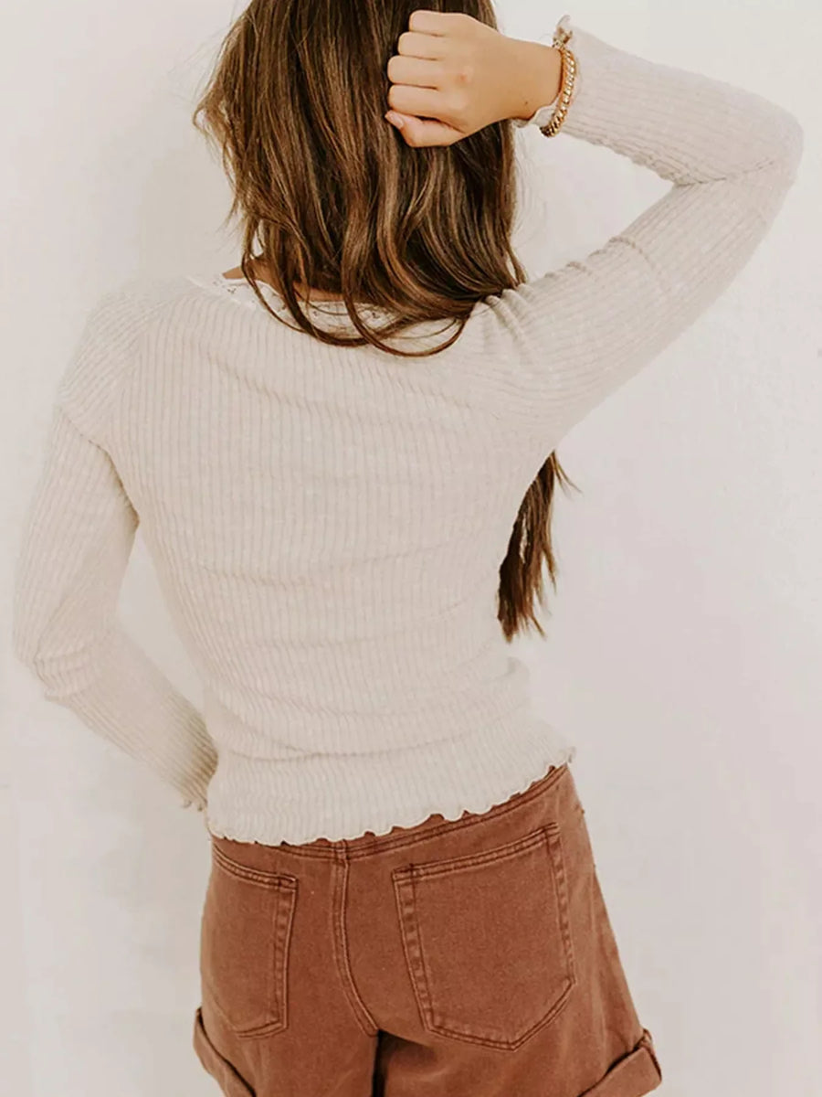 Beige ribbed long-sleeve top with lace trim and lettuce hem