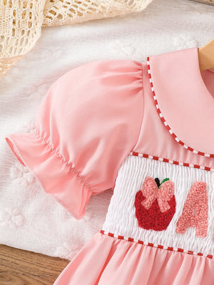 Pink A-line dress with knee-length and button