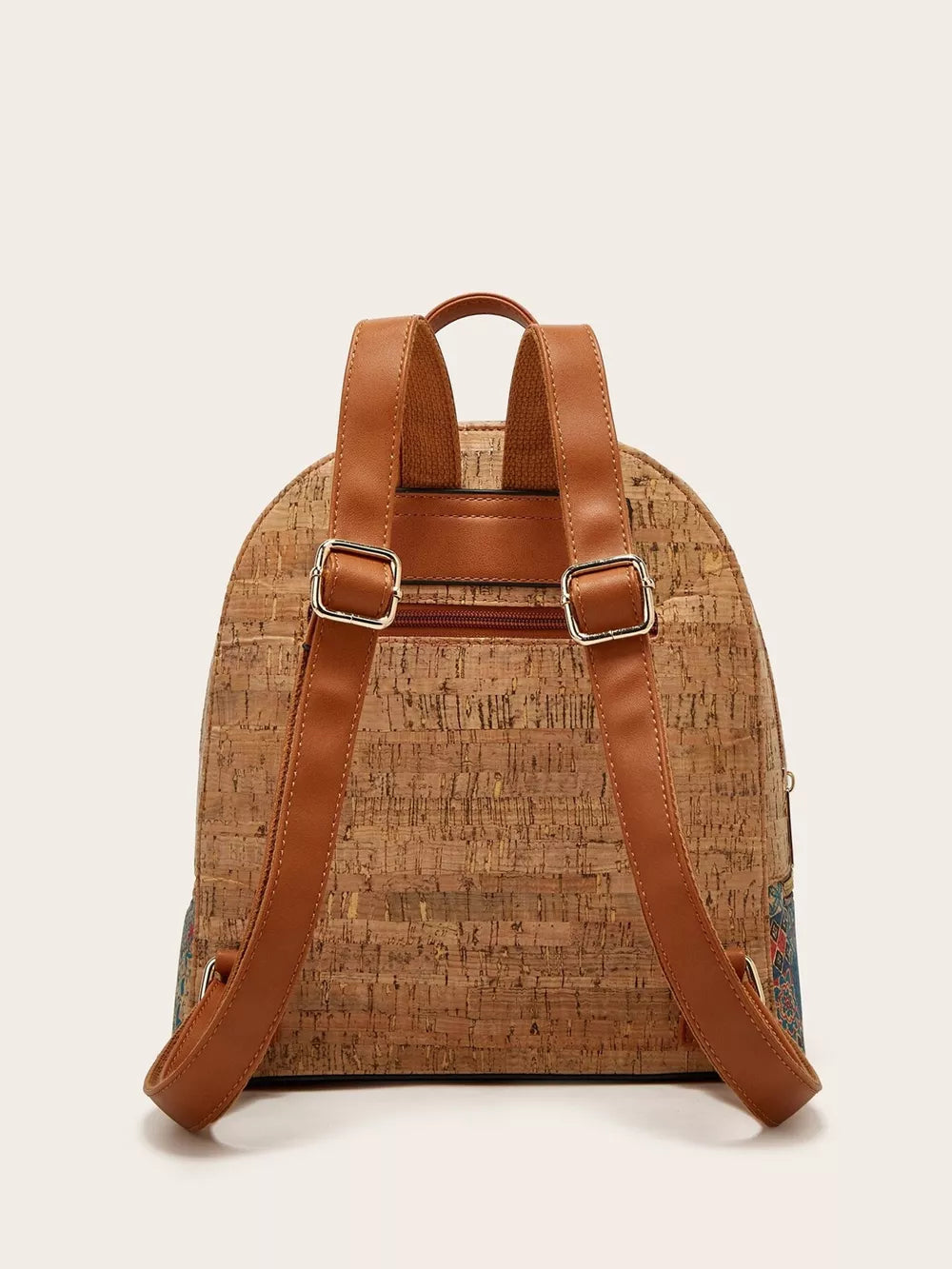 Cork backpack with adjustable brown straps and a colorful embroidered side panel.