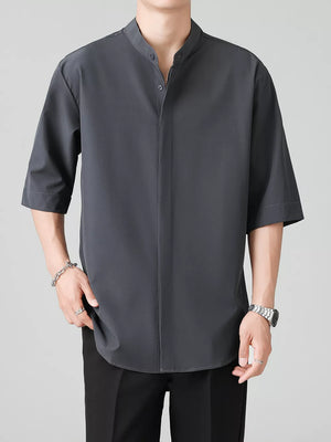 Dark gray oversized Mandarin collar half-sleeve shirt with button-down front.