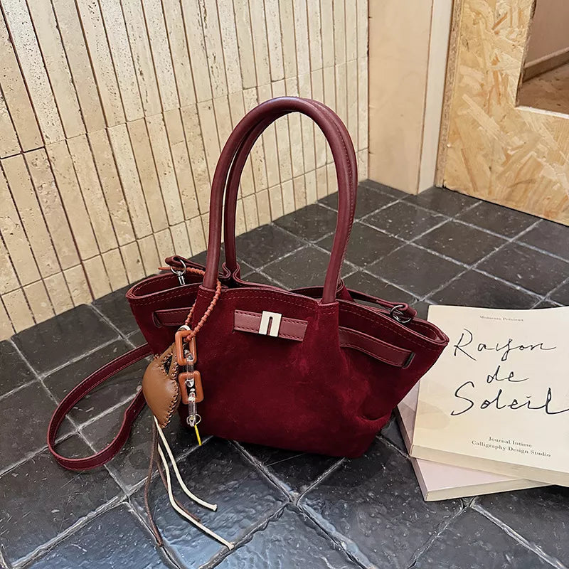 Burgundy suede and leather mini tote bag with charm detail