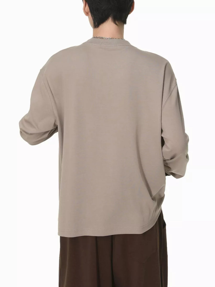 Men's relaxed fit long sleeve t-shirt in coffee color cotton, shown from the back.