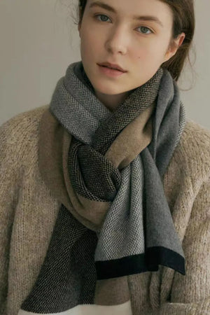 Colorblock merino wool scarf in camel and grey with a subtle houndstooth pattern.