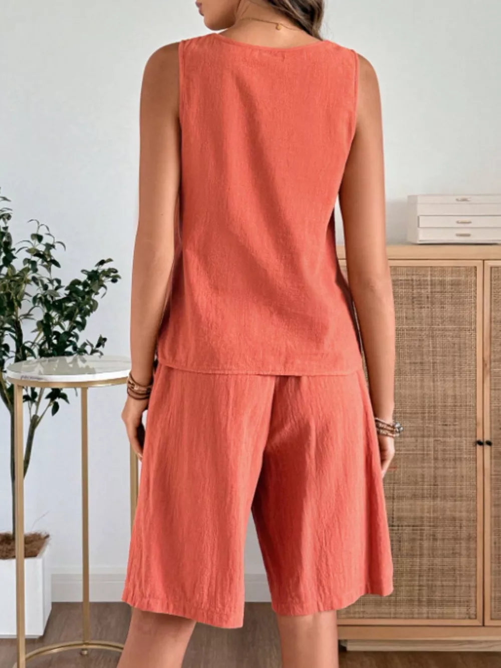 Orange-red relaxed fit tank top and shorts set with a scoop neck and elastic waist shorts.