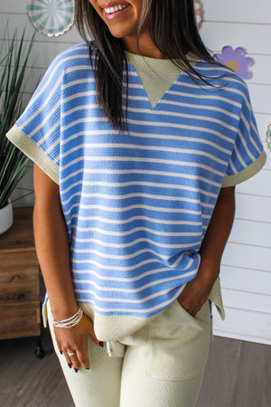 Relaxed fit blue and white striped t-shirt with a V-neck and contrasting trim.