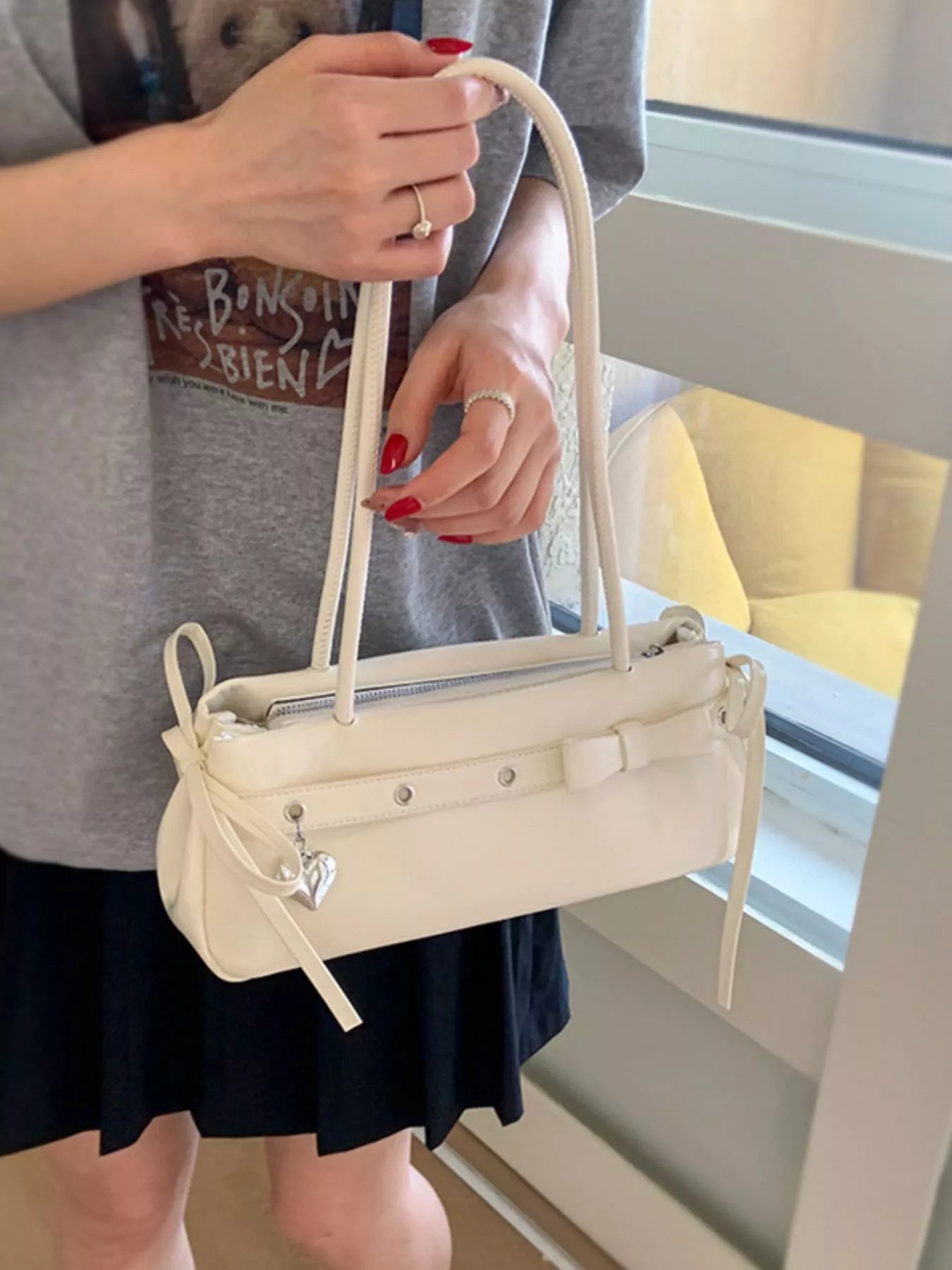 Chic white PU leather shoulder bag with bow detail and heart charm