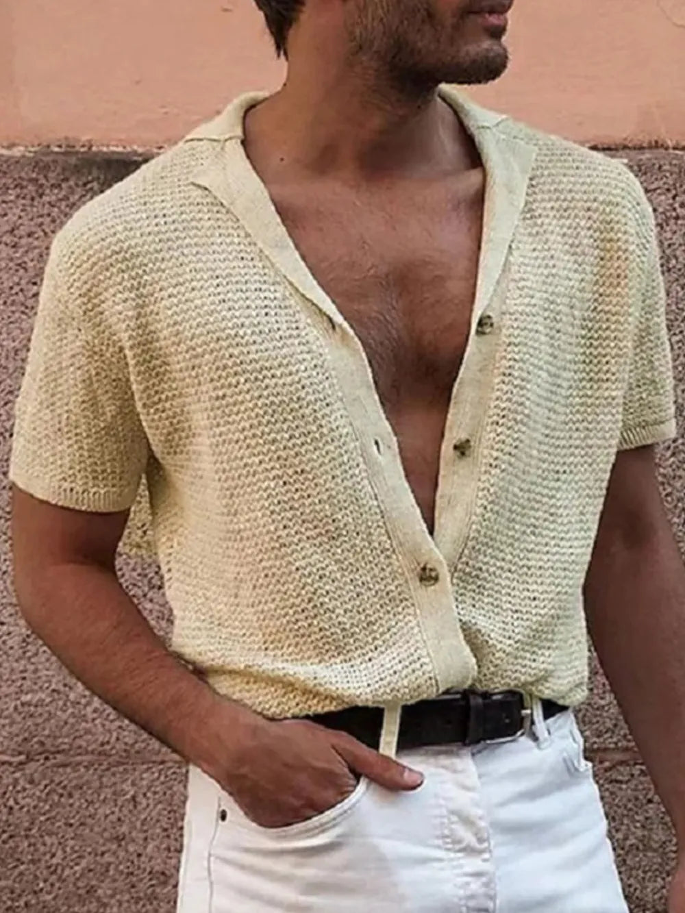 Textured knit resort shirt in ivory with short sleeves and a button-up collar.