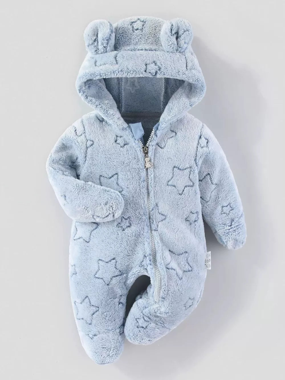 Light blue plush baby one-piece with hood, bear ears, and star pattern.