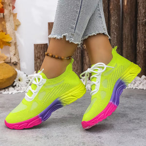 Breathable mesh lace-up sneakers in neon yellow with pink and purple gradient sole.