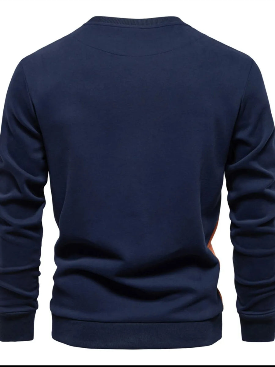 Navy crew neck sweatshirt with color block side panel detail.