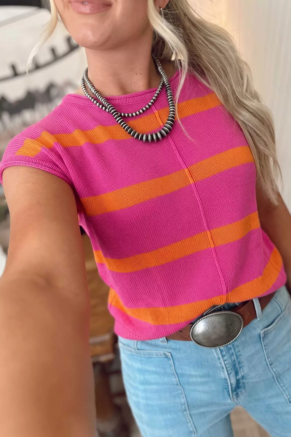 bright orange pullover sweater featuring stretch and striped